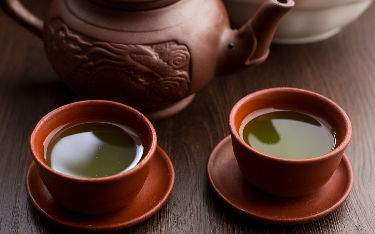 Two cups of matcha tea in a restaurant